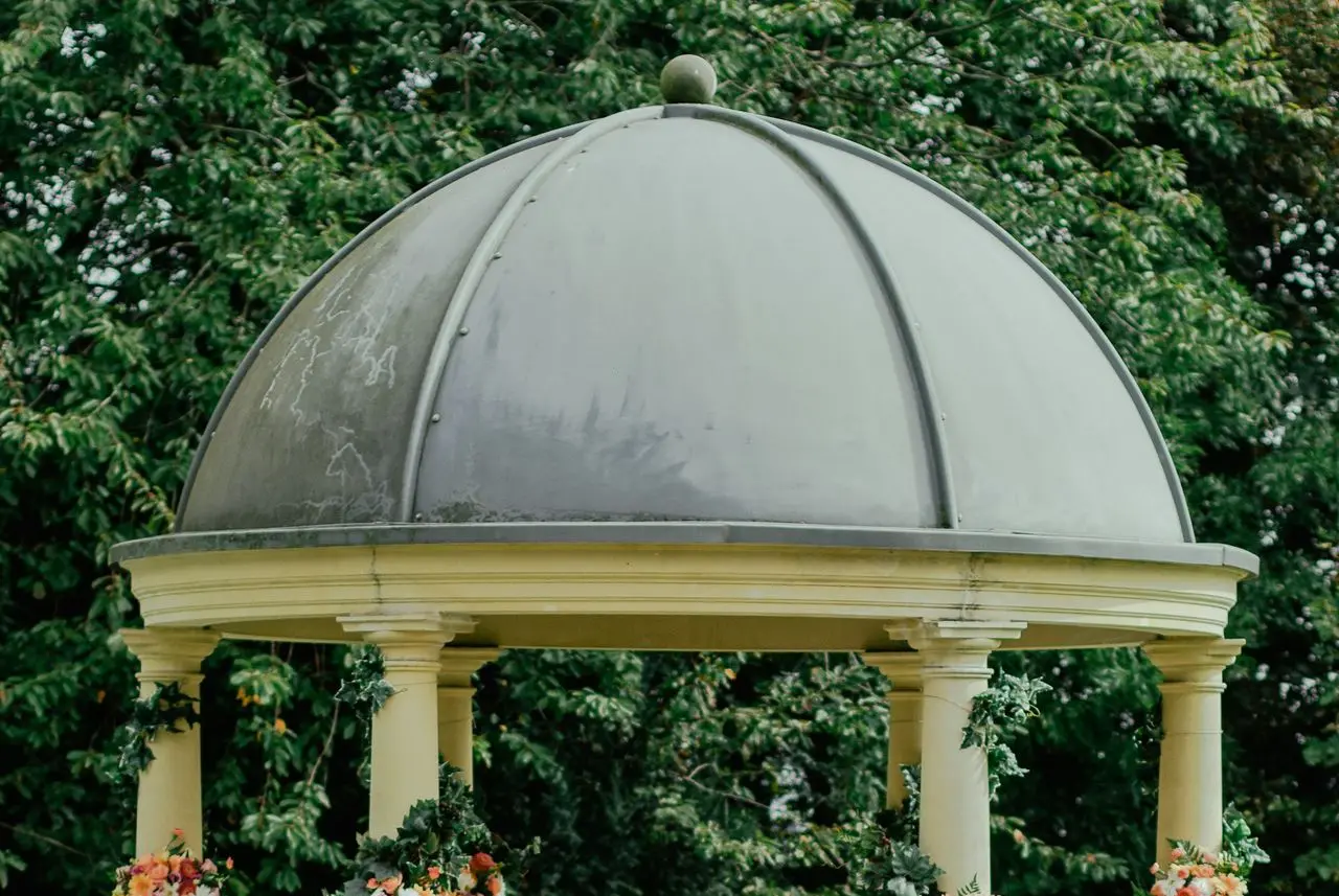 gray and beige gazebo near green leafed tree